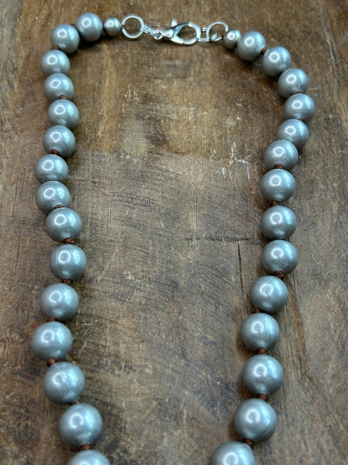 Metal Pistol and Native American-Themed Necklace